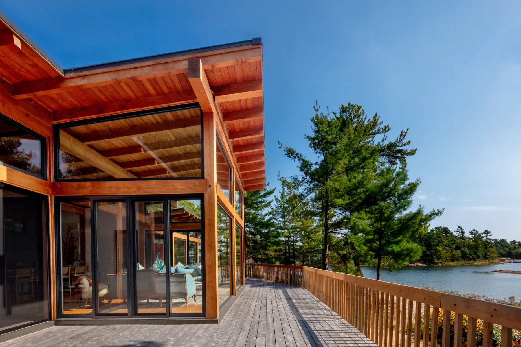 Georgian Bay Cottage Exterior Main Pod Living Room and Lake Normerica Timber Homes