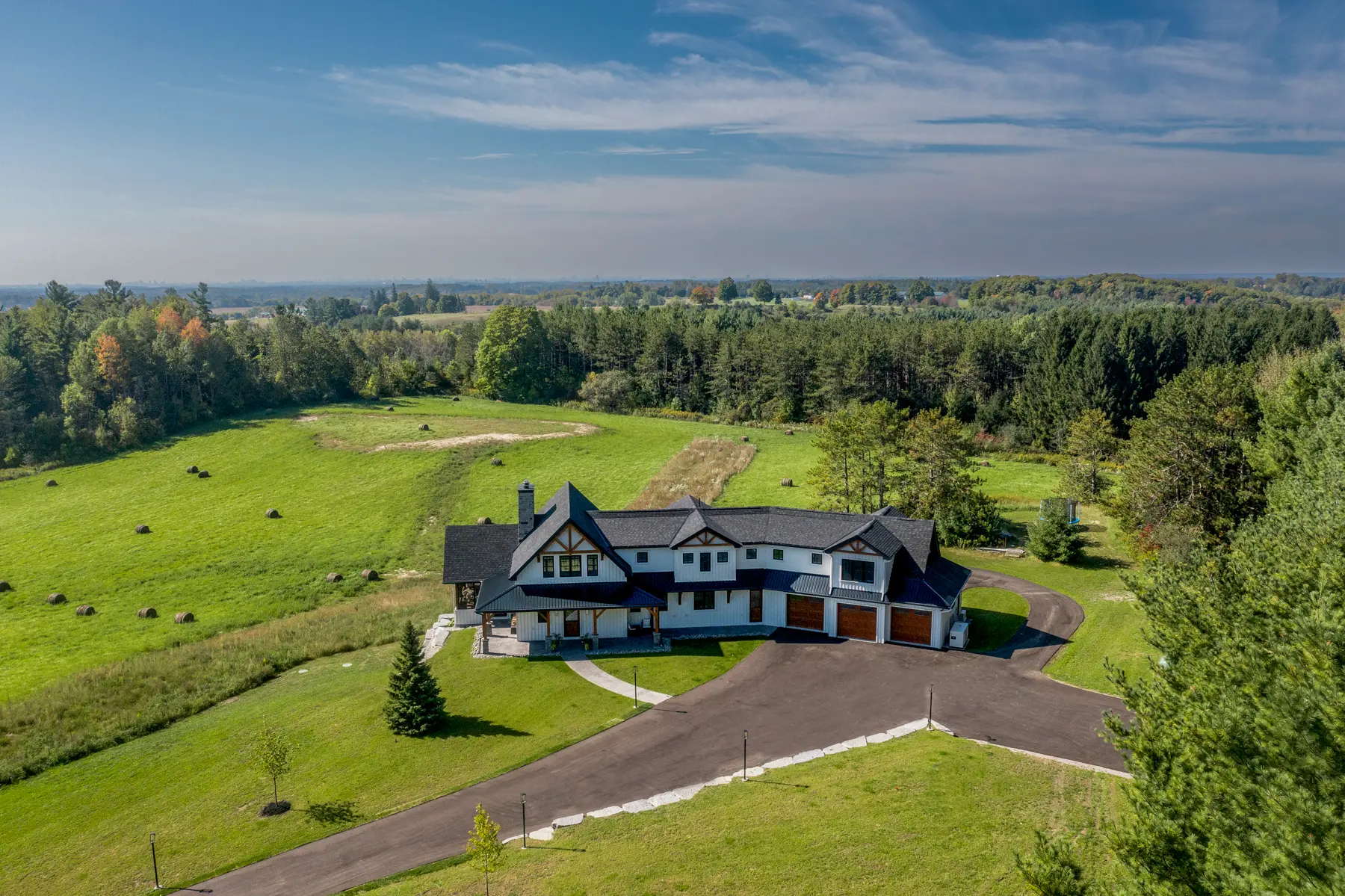 Modern Farmhouse Exterior Aerial View Front with Fields Normerica Timber Homes