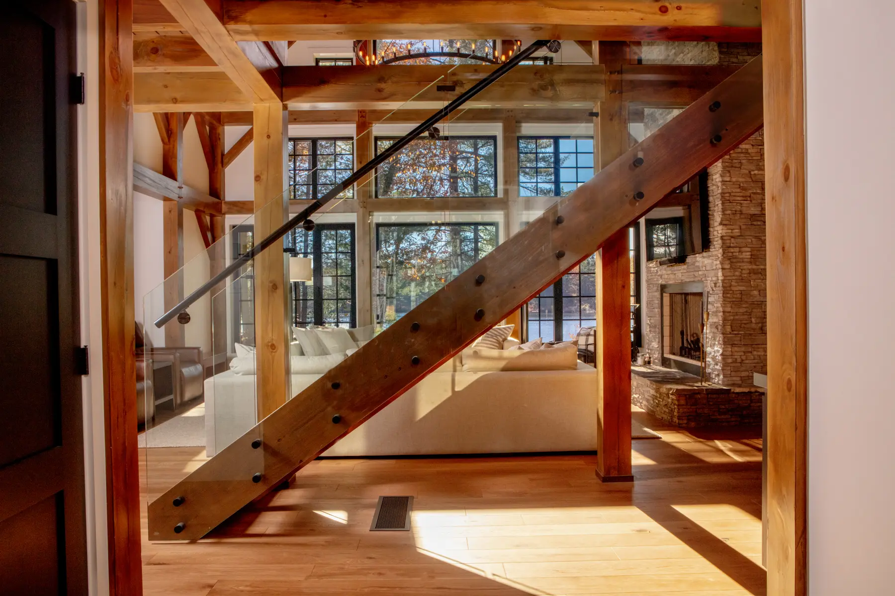 Traditional Lakeside Cottage Project Portfolio Lakeside Escape Interior Entry View Stairs Great Room Lakeview Normerica Timber Homes