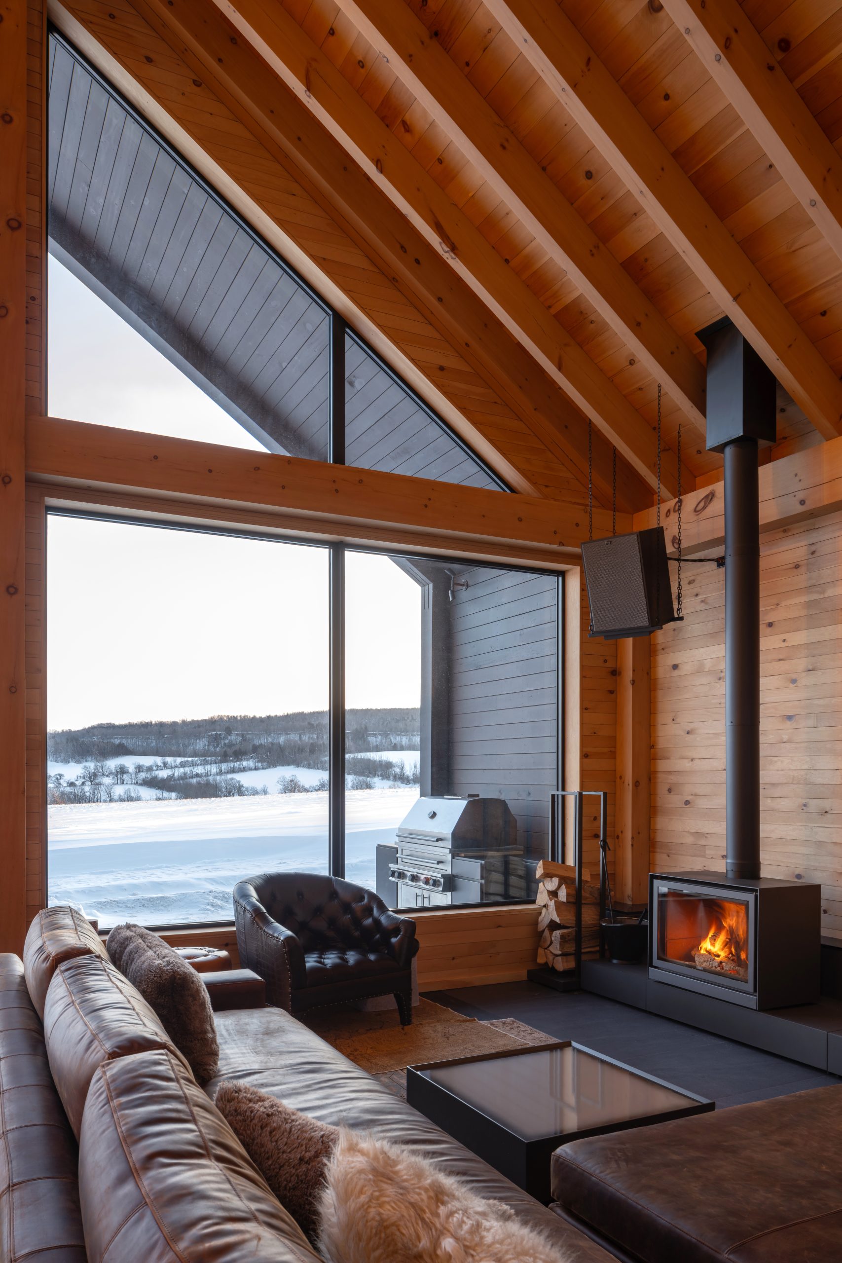 gateway to a rural getaway timber frame gatehouse normerica interior fire stove