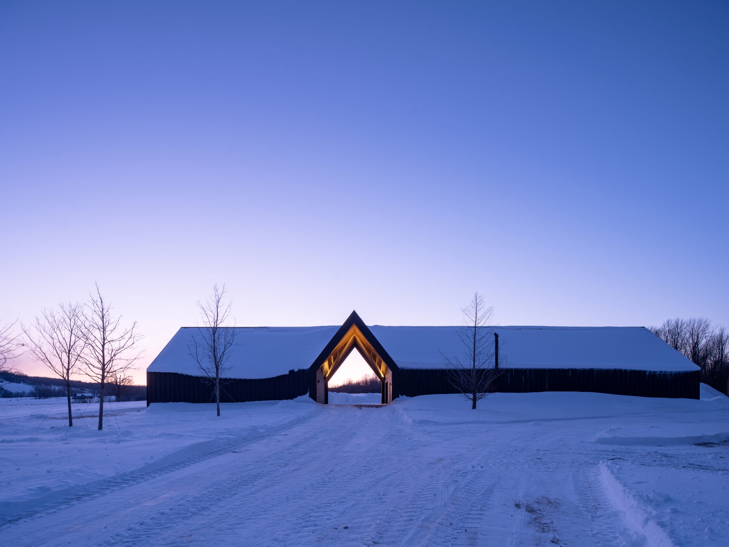 gateway to a rural getaway timber frame gatehouse normerica exterior night front