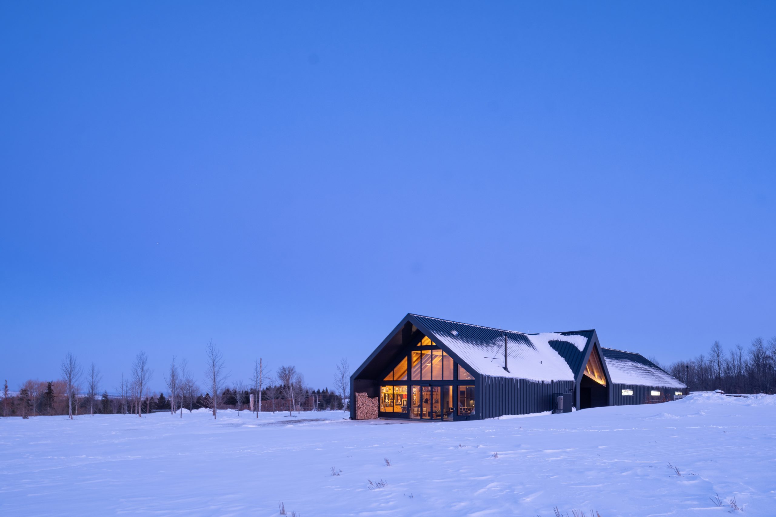 gateway to a rural getaway timber frame gatehouse normerica exterior angle night flip