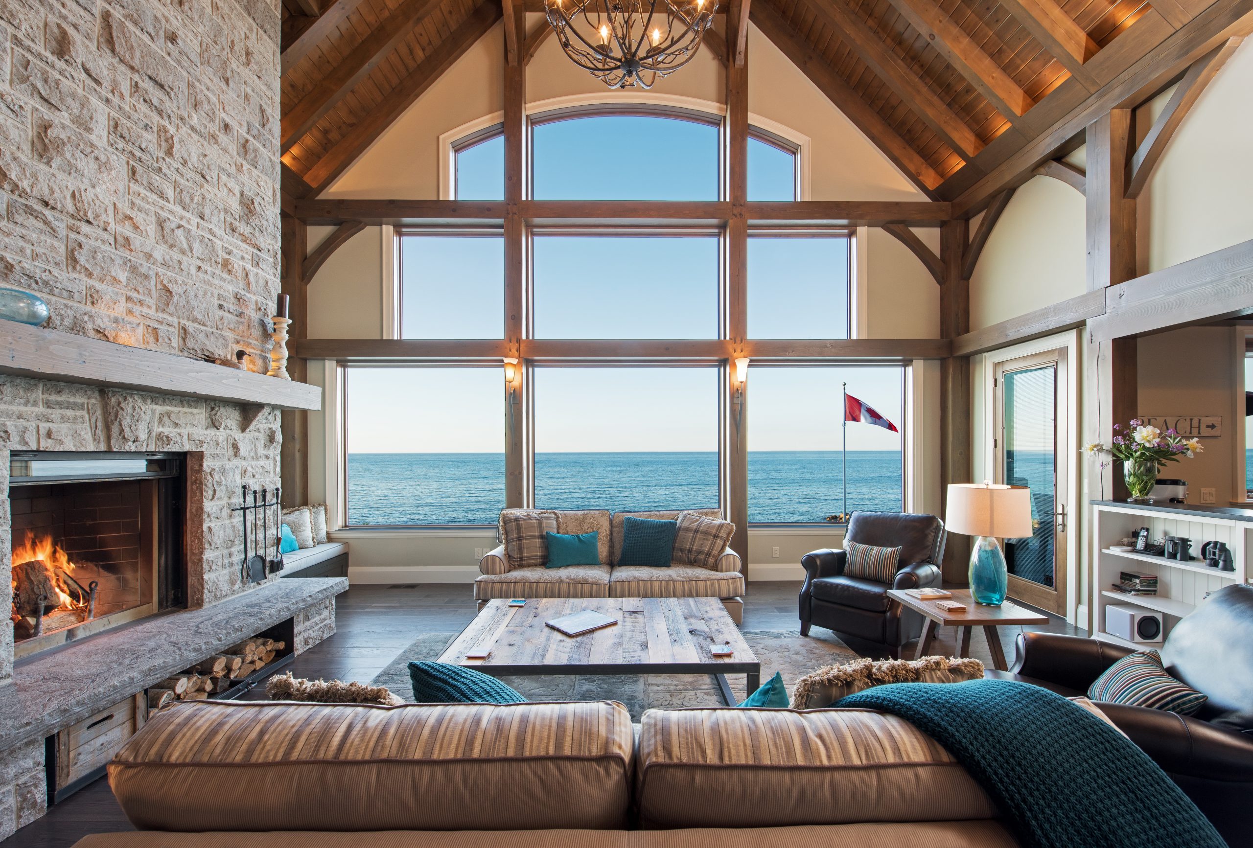 perfect harmony custom timber frame waterfront residence living room window wall