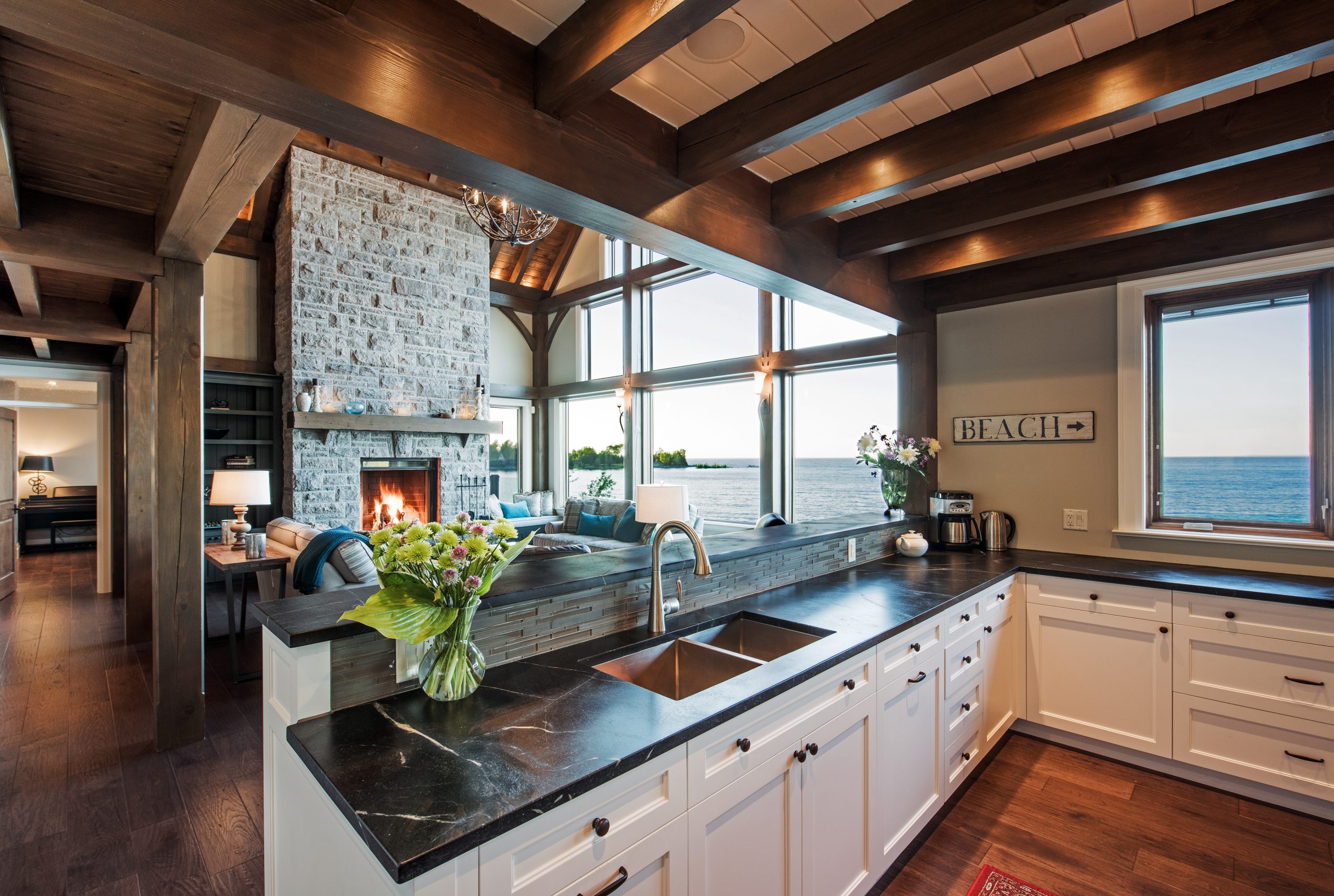 perfect harmony custom timber frame waterfront residence kitchen into living room