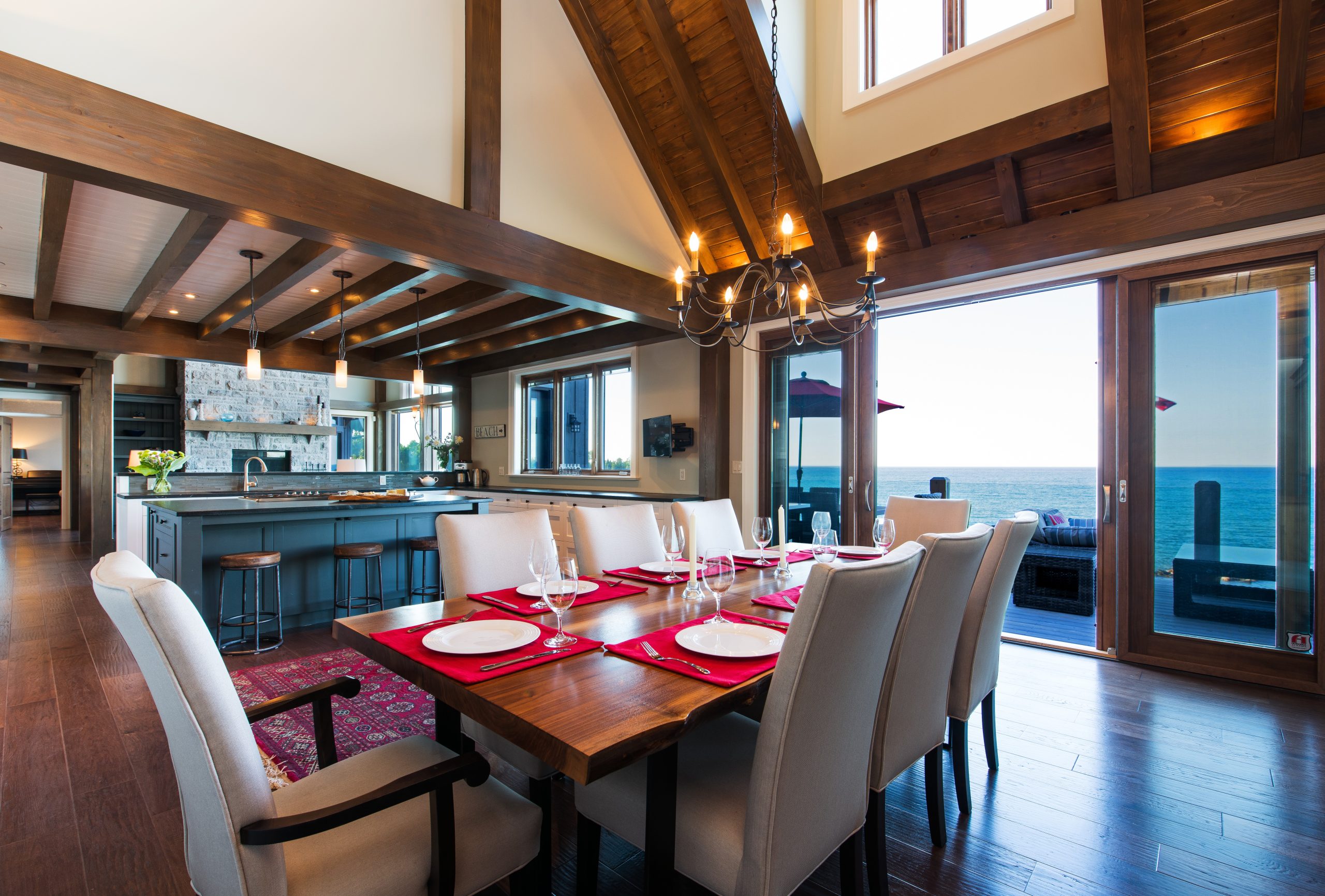 perfect harmony custom timber frame waterfront residence dining room to kitchen